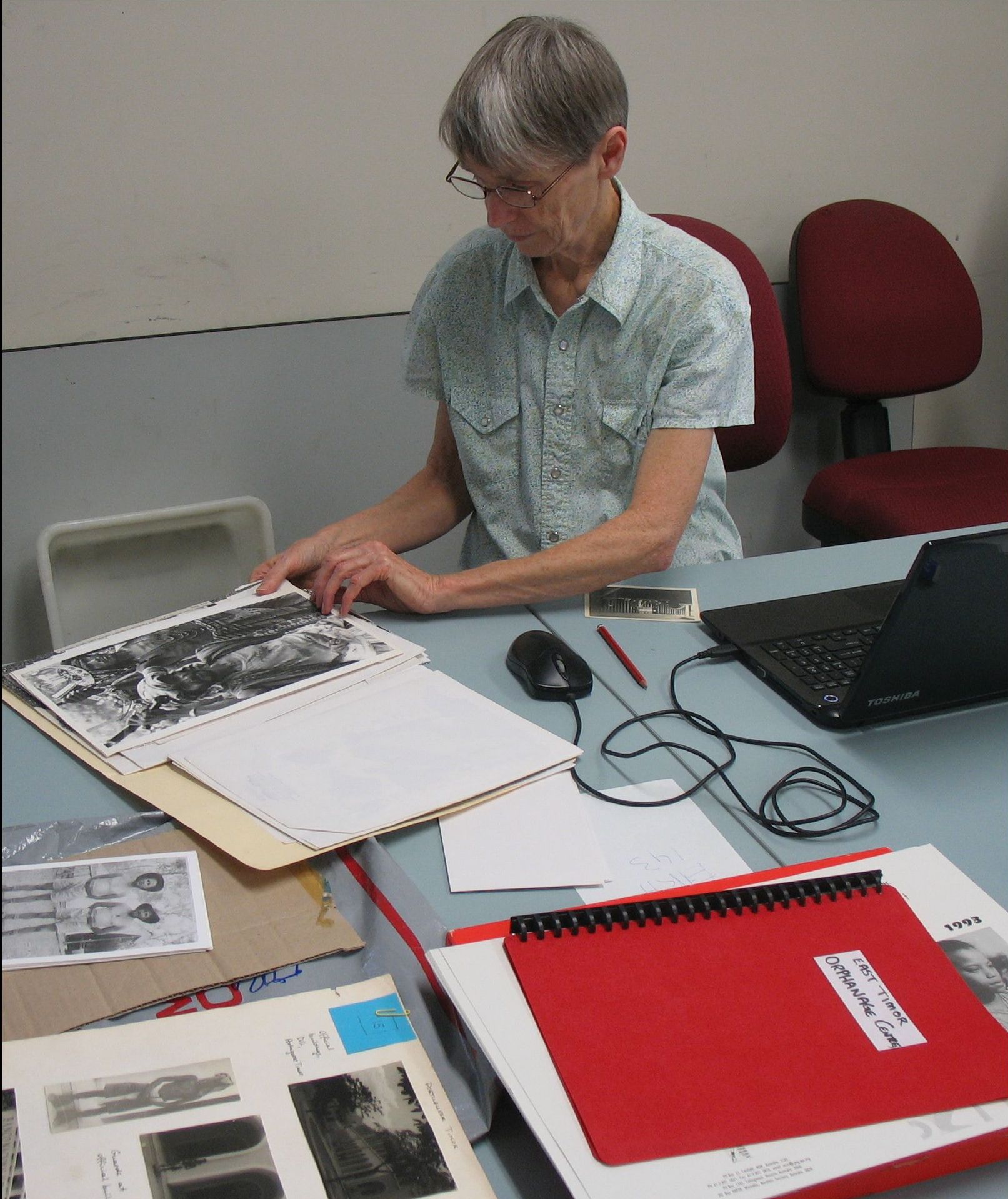 Describing photographs at Sydney office.