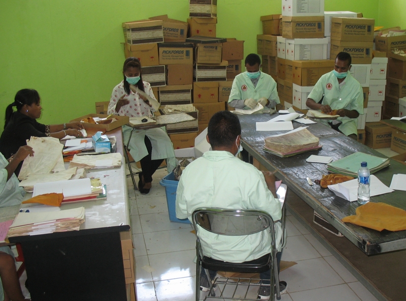 Hive of activity: National Archives staff cleaning and rehousing historical files.